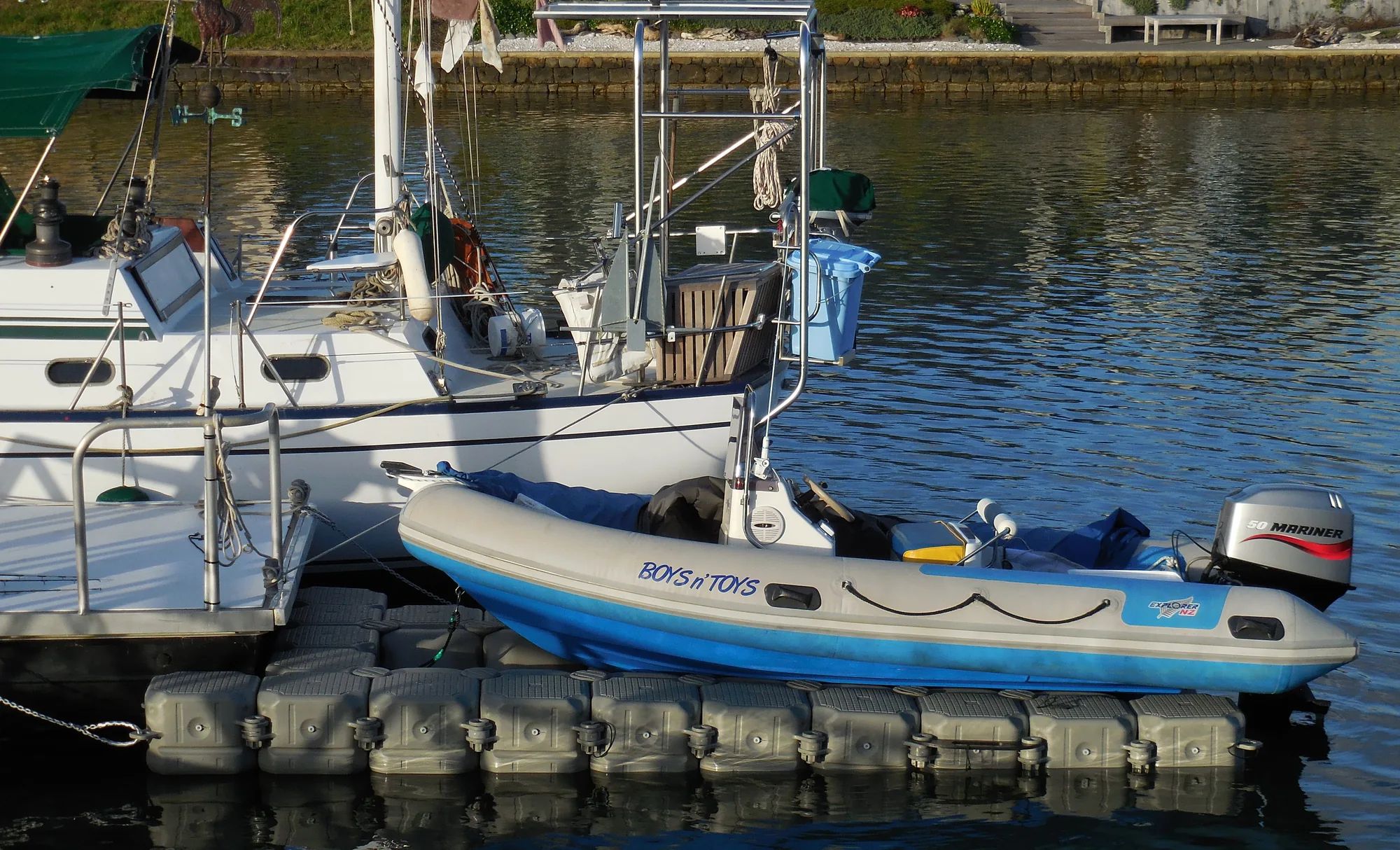 Inflatable boat with an outboard on a modular dry-berth dock