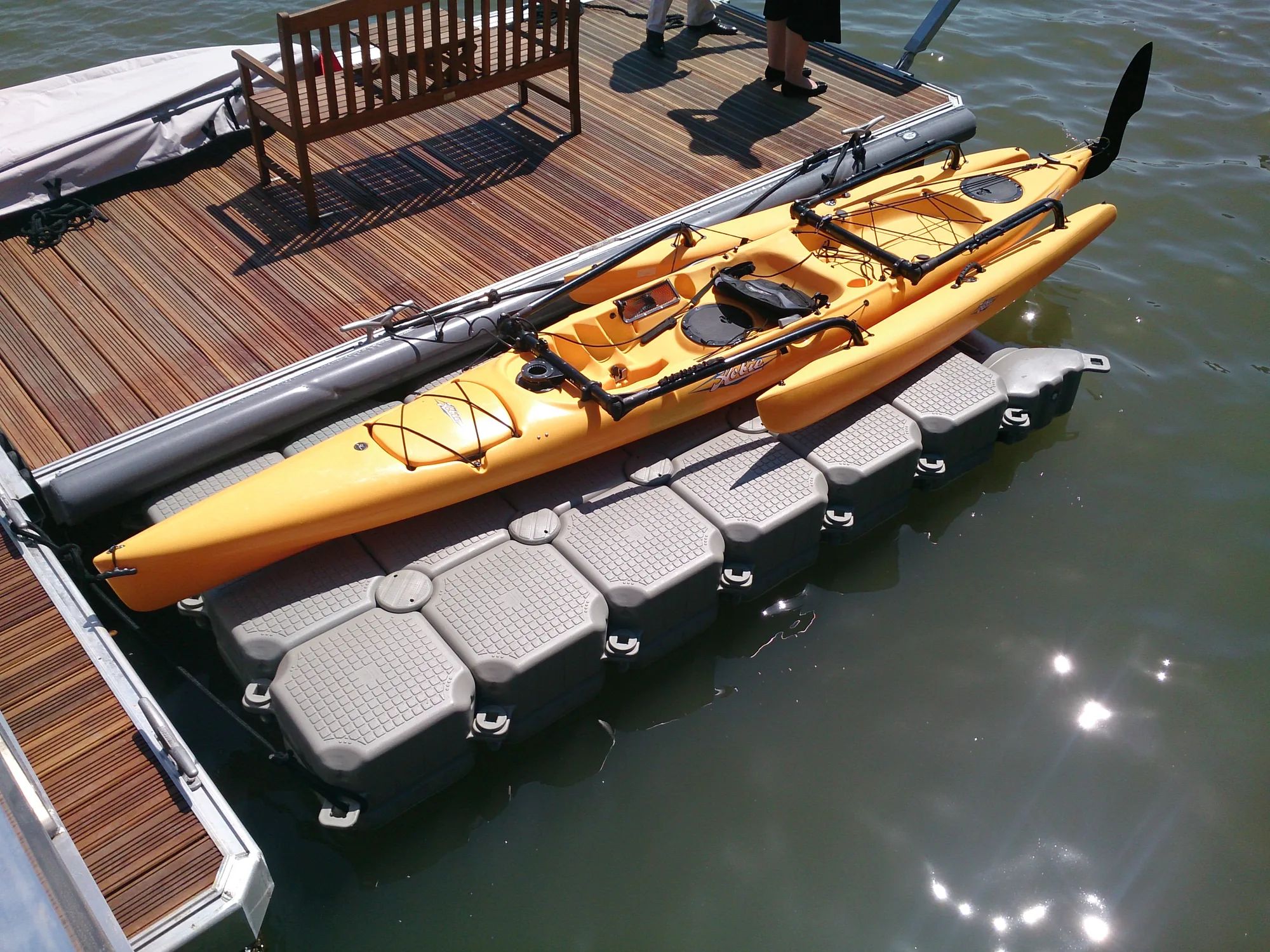 Hobie trimaran kayak on a modular launch dock beside a timber jetty