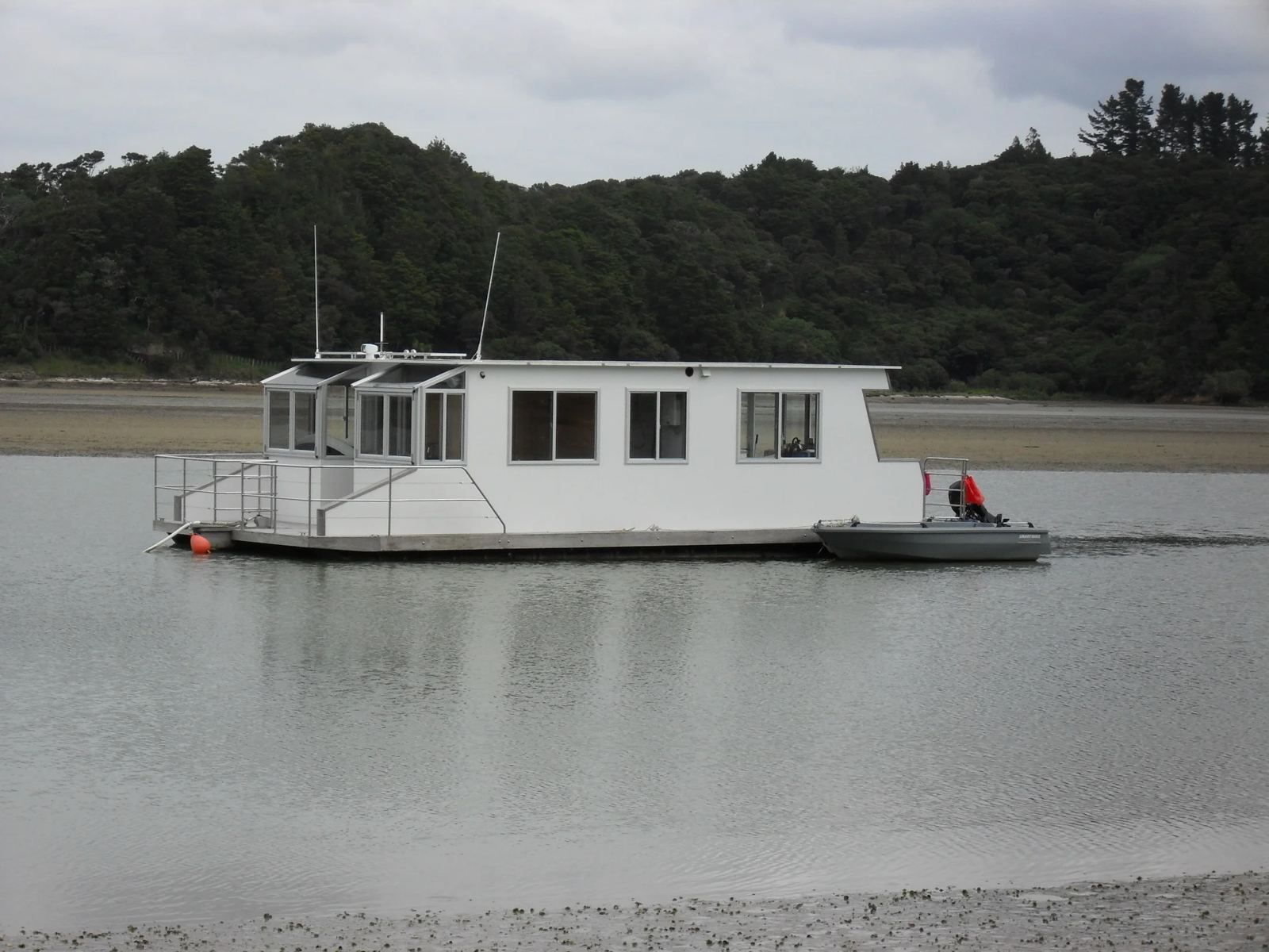 White floating house on a pod platform
