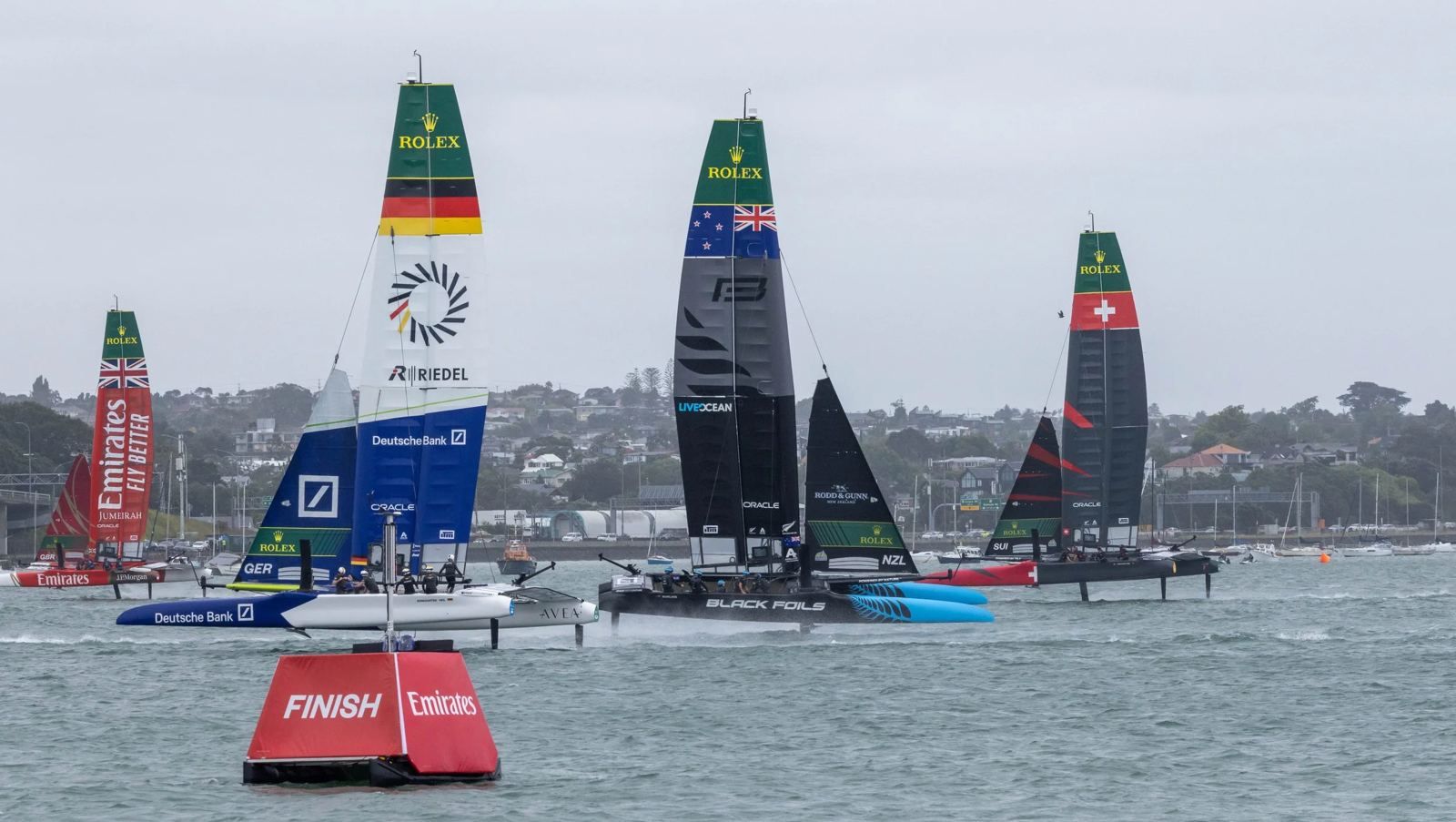 SailGP fleet racing past a Pontoonz marker boat
