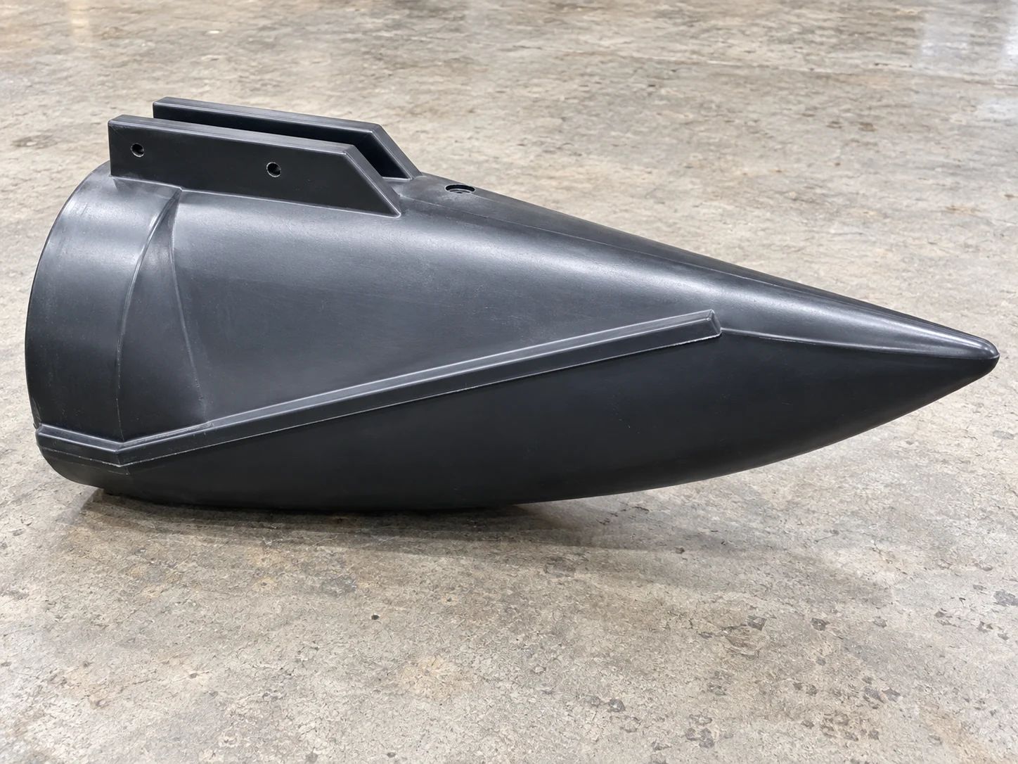 Illustration of the black Speed Bow Pod, showing its long tapered nose and top mounting rails